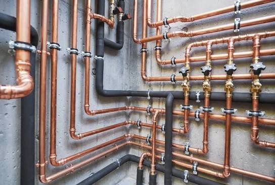 Copper refrigerant piping installation by professional HVAC technicians